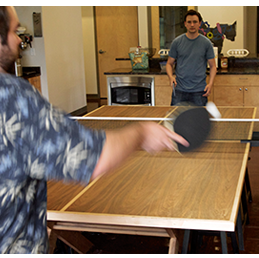 Rustici staff playing ping pong